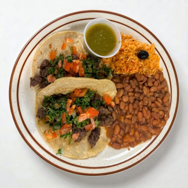 Tacos de Bistec o Puerco (Tacos Steak or Pork).
