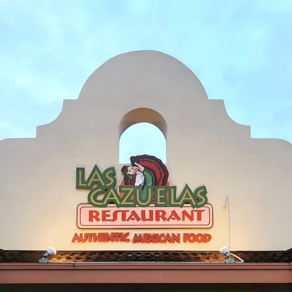 The Las Cazuelas Restaurant & Cantina sign, featuring a woman in a traditional Mexican dress.